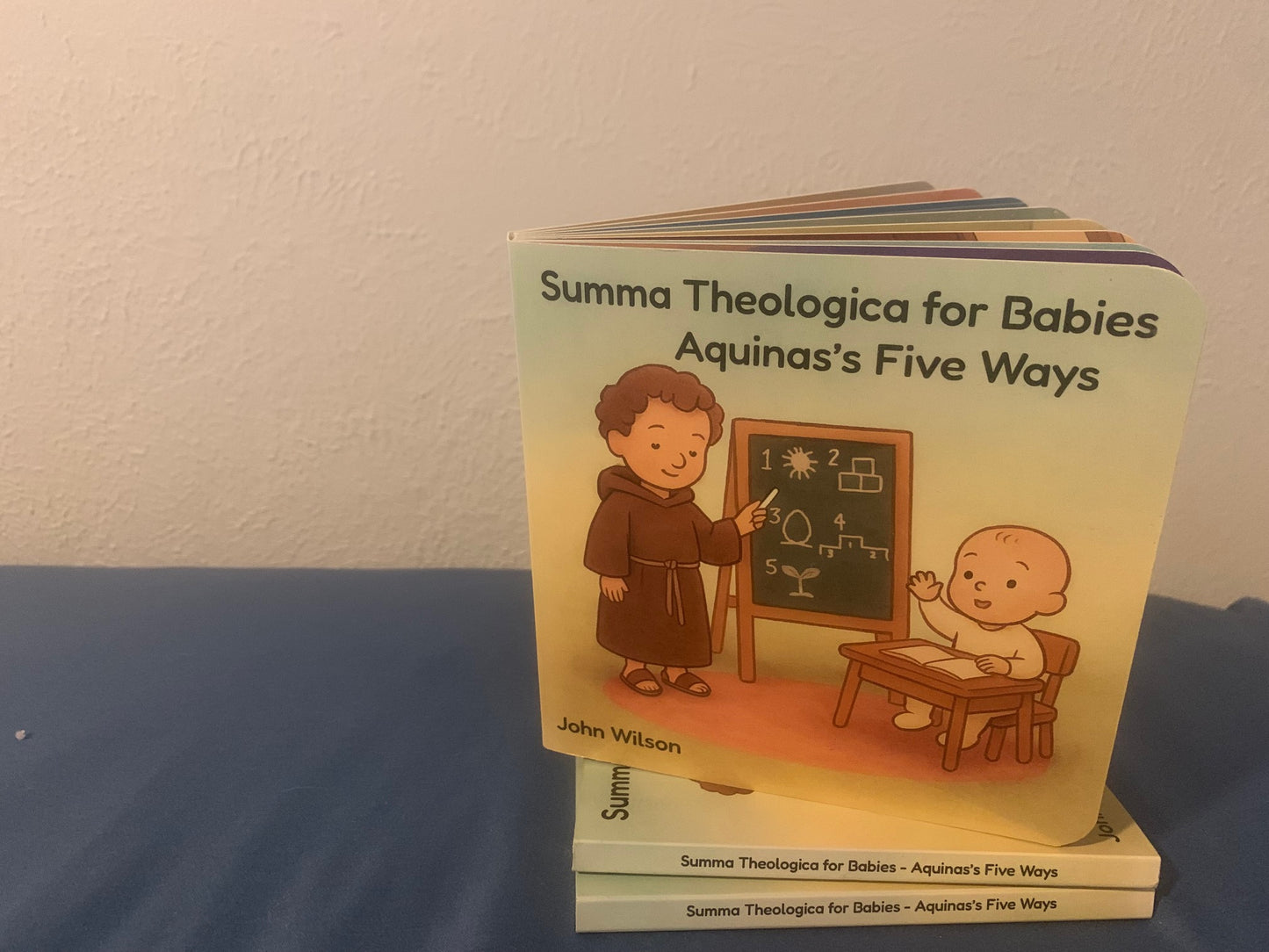 Catholic Baby Board Book titled 'Summa Theologica for Babies: Aquinas's Five Ways' By John Wilson Published by Cradle Catholic Press